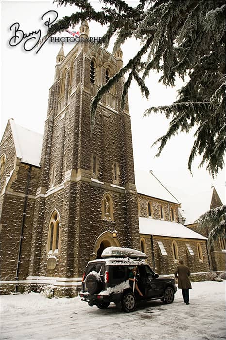 land rover in snow outside church