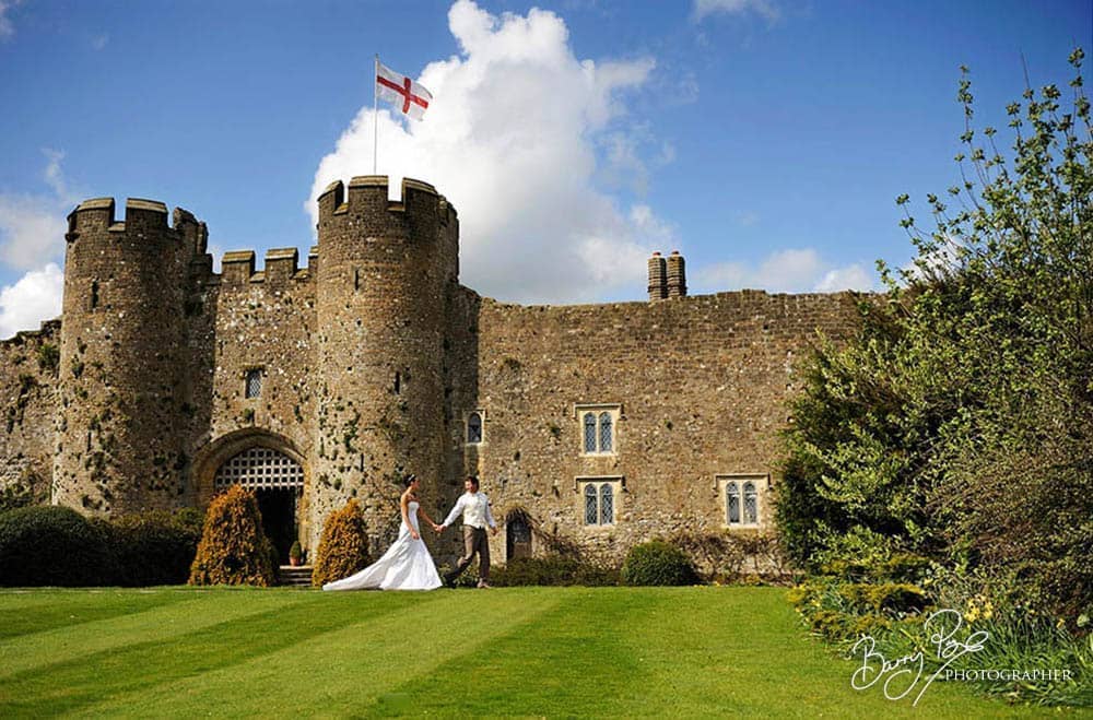 bride and groom walk castle grounds